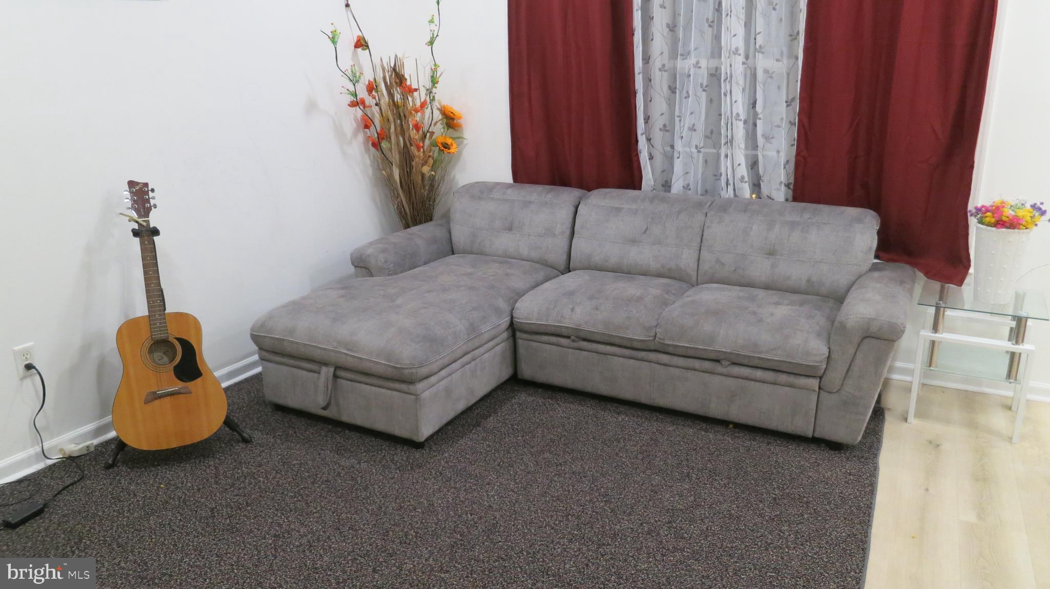 121 Kyle Way Ewing, NJ 08628 - Photo 7 of 25 a living room with furniture and a window