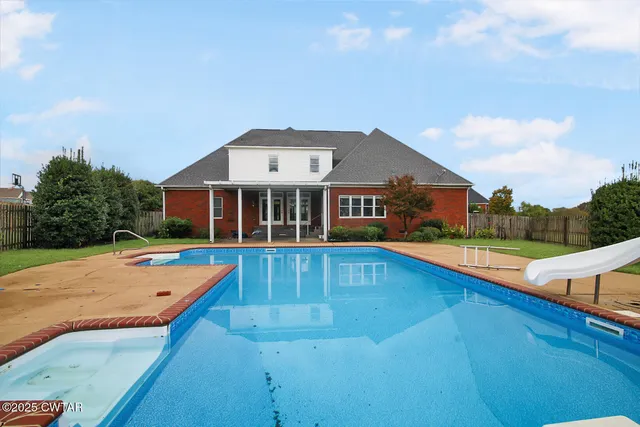 a front view of a house with swimming pool