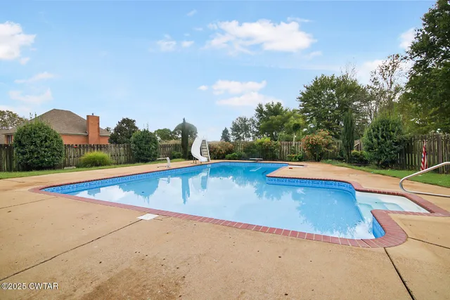 a view of a swimming pool with an outdoor space
