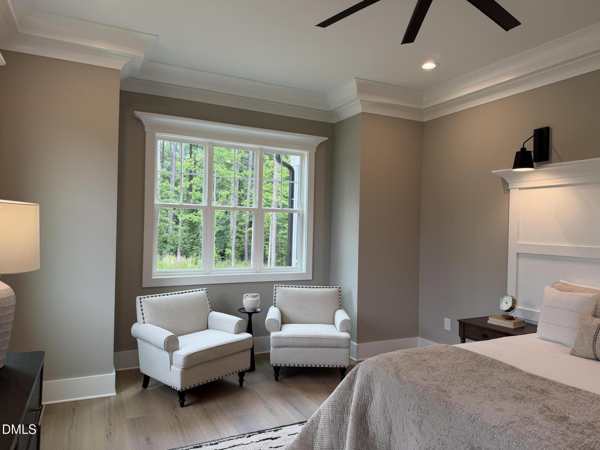 2590 Lassiter Road Four Oaks, NC 27524 - Photo 32 of 72 a bedroom with a bed and a couch
