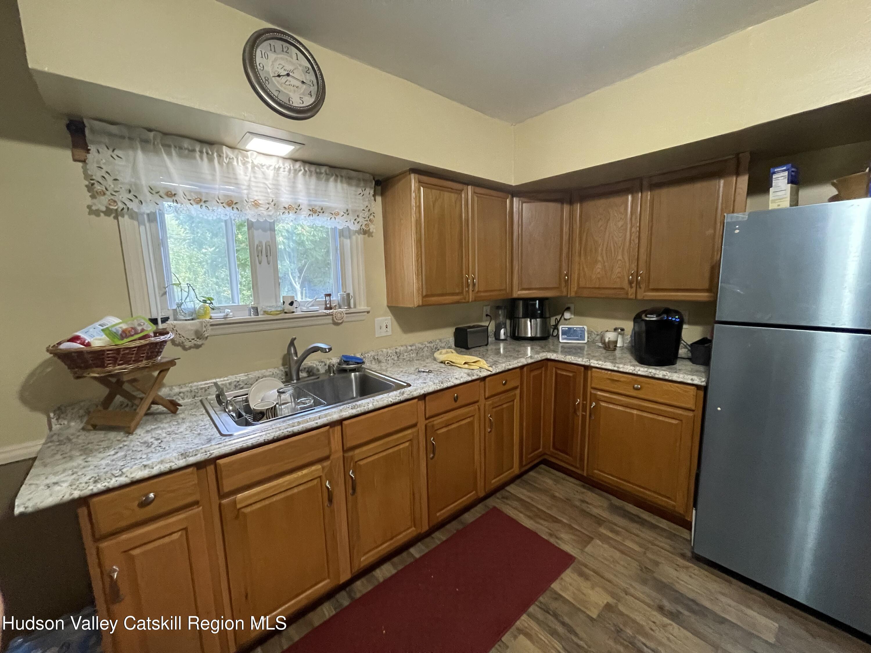 10 Johns Road Kerhonkson, NY 12446 - Photo 8 of 30 a kitchen with stainless steel appliances granite countertop a refrigerator sink and cabinets