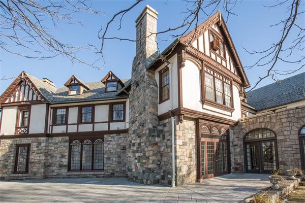 99 Westcliff Road Weston, MA 02493 - Photo 19 of 29 a view of a brick house with many windows