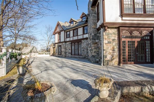 99 Westcliff Road Weston, MA 02493 - Photo 21 of 29 a view of a brick house with many windows