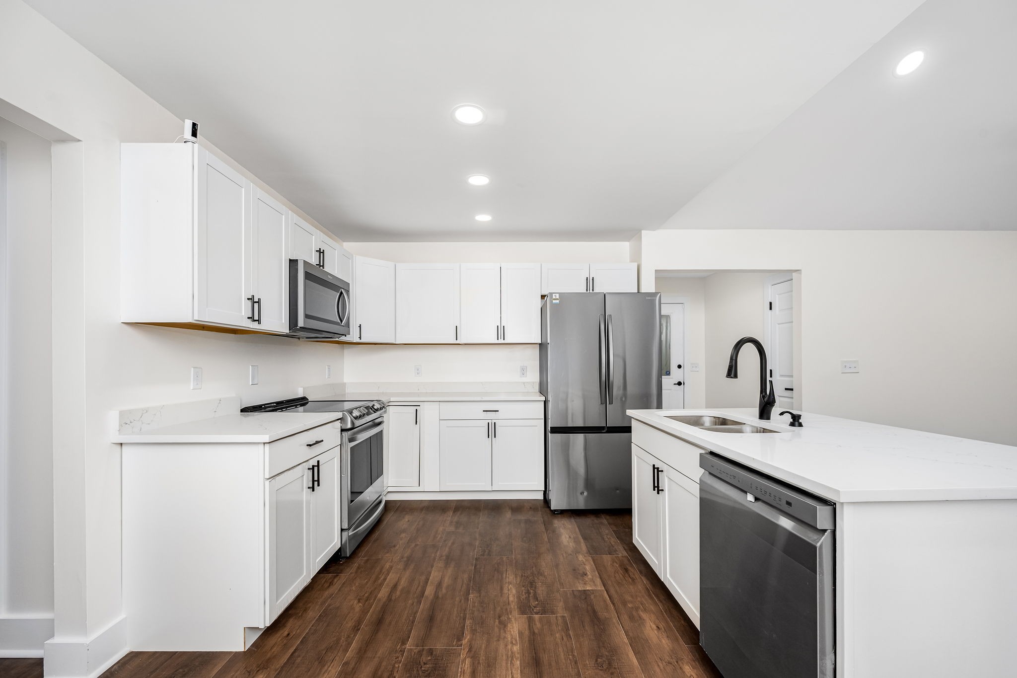 2712 Oak Point Street Murfreesboro, TN 37130 - Photo 13 of 45 a kitchen with a sink a stove a refrigerator and cabinets