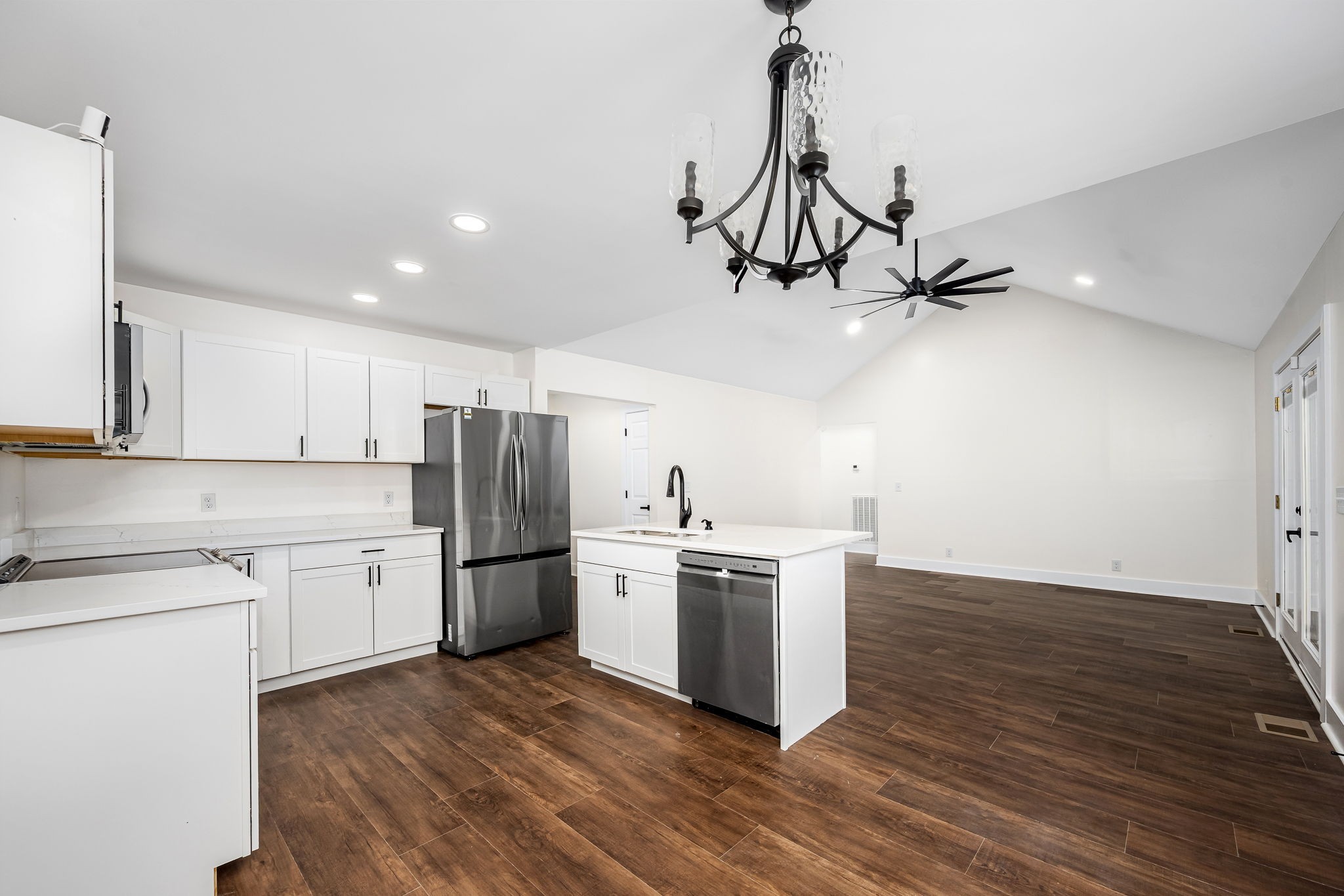 2712 Oak Point Street Murfreesboro, TN 37130 - Photo 14 of 45 a kitchen with a stove a refrigerator and a sink