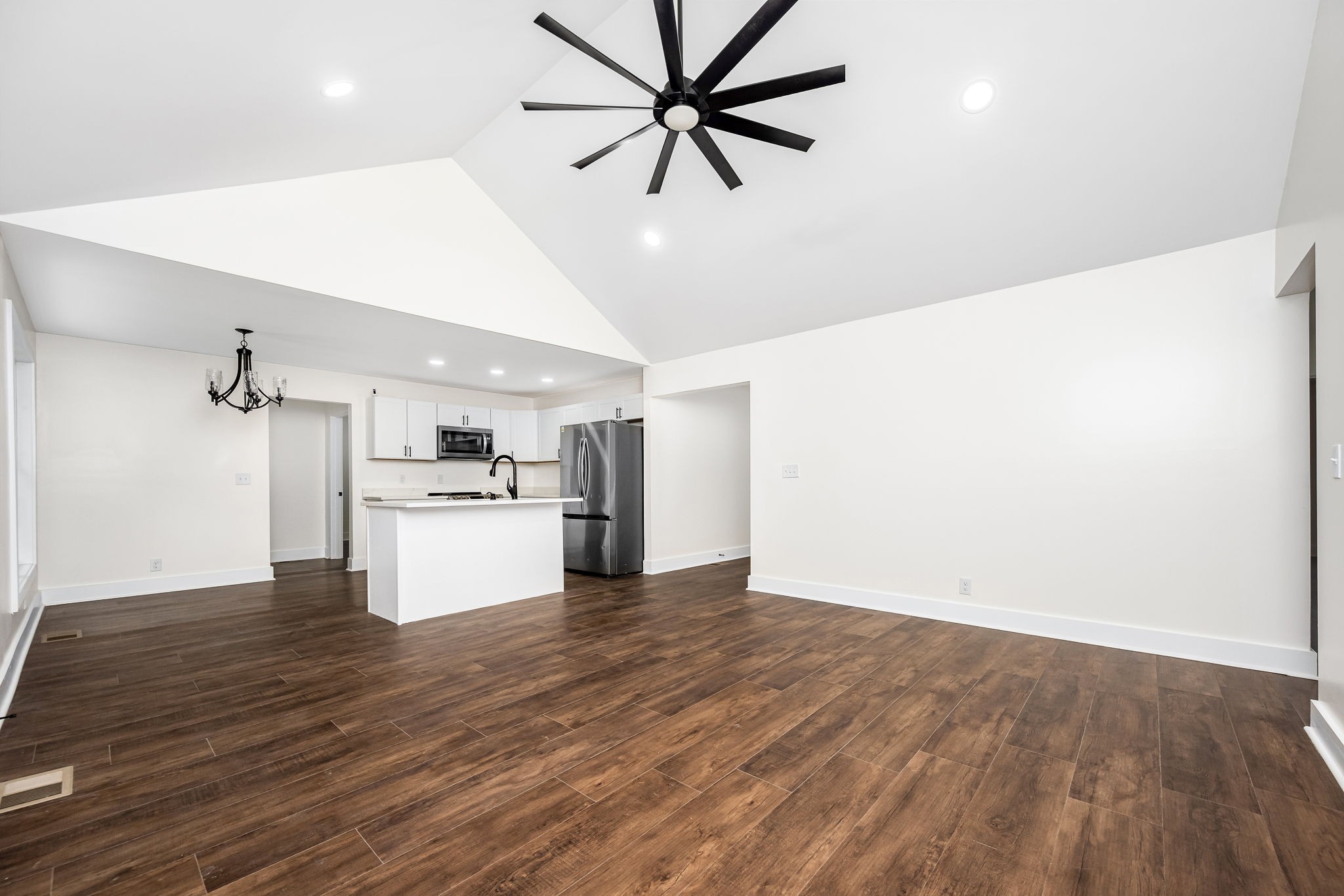 2712 Oak Point Street Murfreesboro, TN 37130 - Photo 15 of 45 a view of a kitchen with a sink and dishwasher a refrigerator with wooden floor