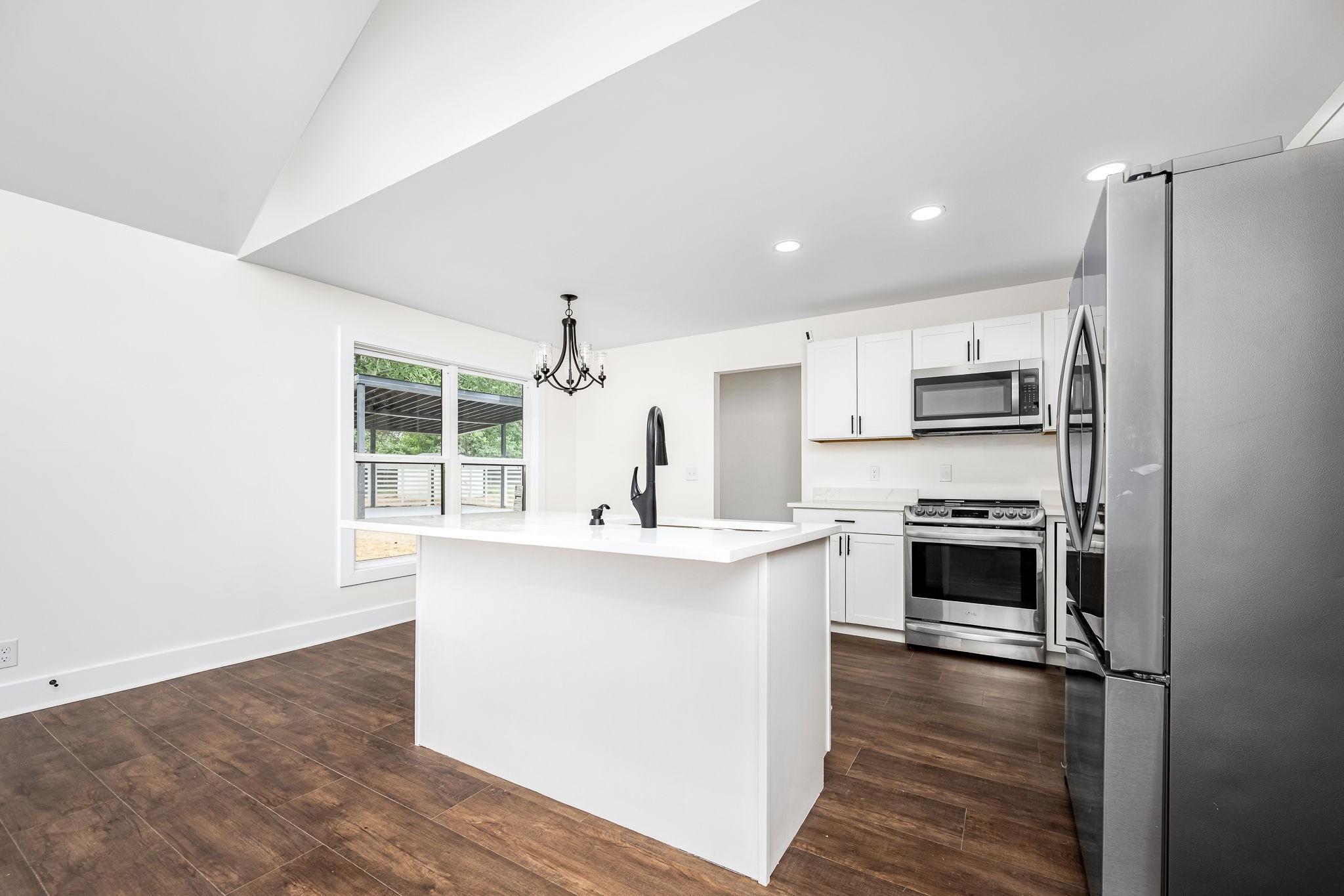 2712 Oak Point Street Murfreesboro, TN 37130 - Photo 18 of 45 a kitchen with stainless steel appliances a stove top oven and white cabinets