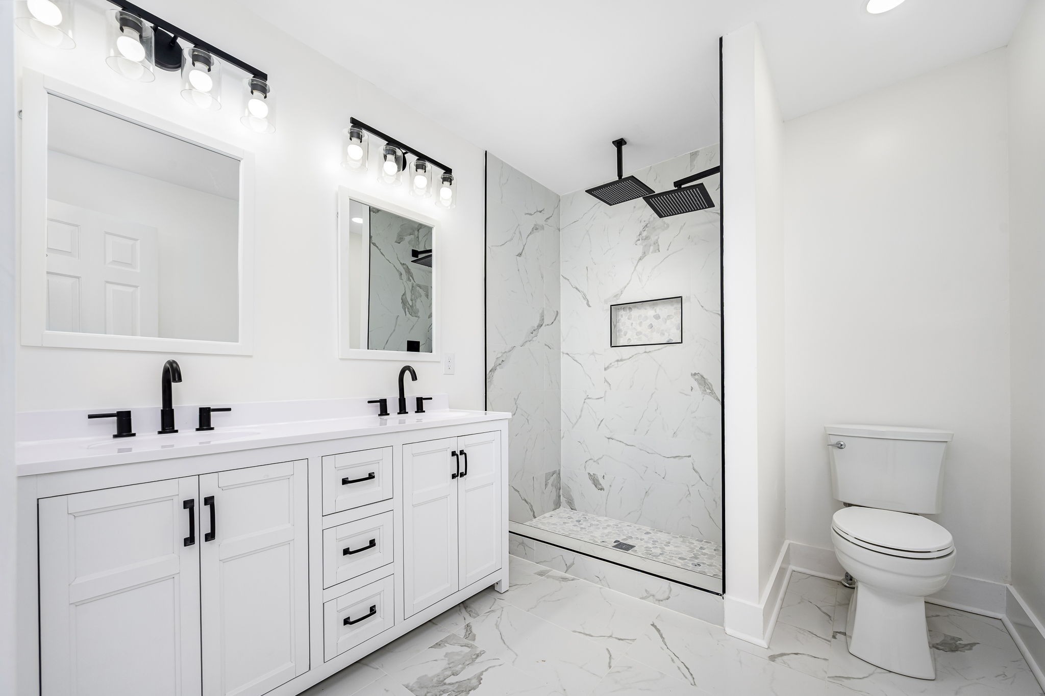 2712 Oak Point Street Murfreesboro, TN 37130 - Photo 23 of 45 a bathroom with a toilet a sink a mirror and a shower