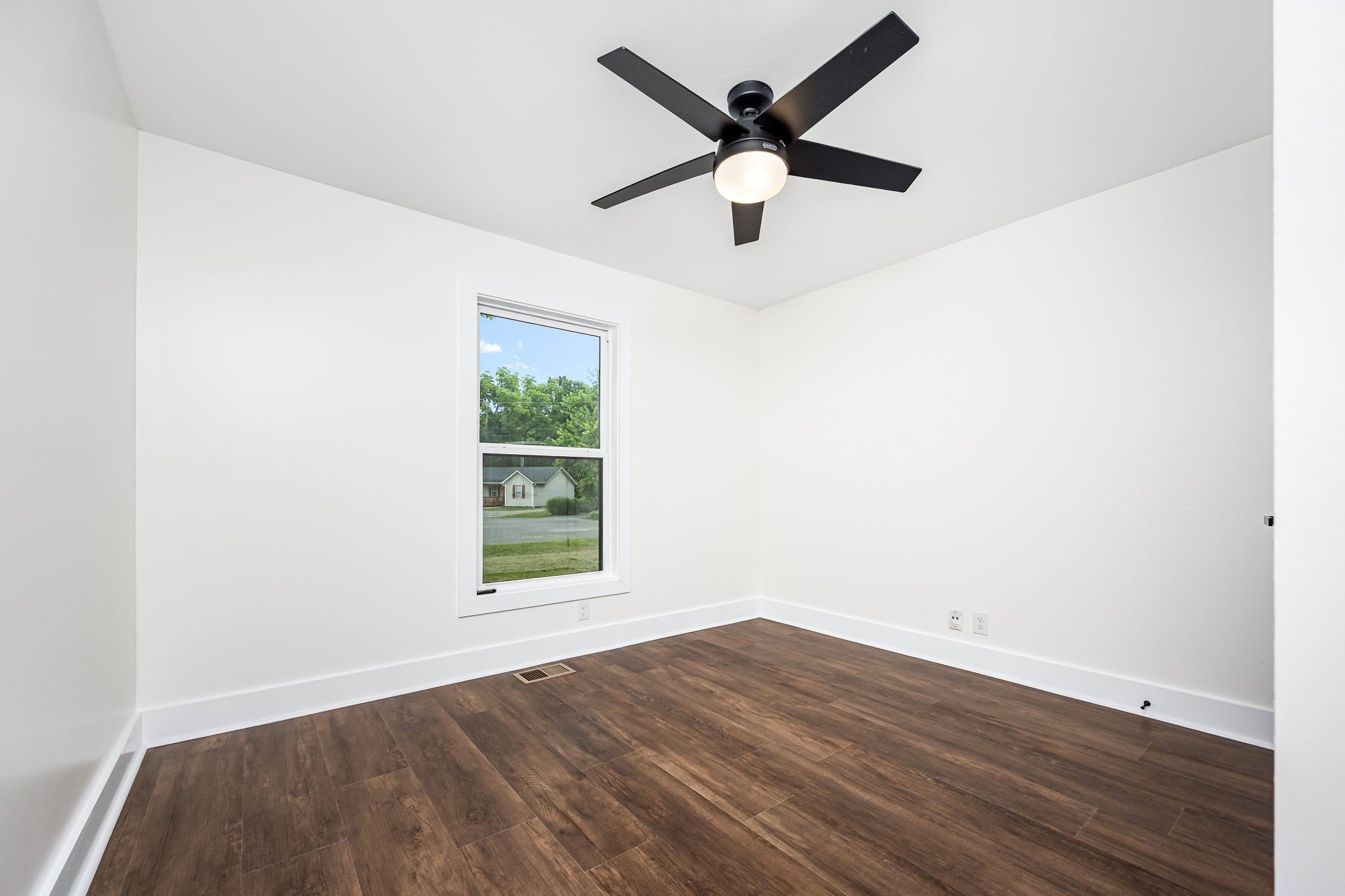 2712 Oak Point Street Murfreesboro, TN 37130 - Photo 29 of 45 an empty room with wooden floor and windows