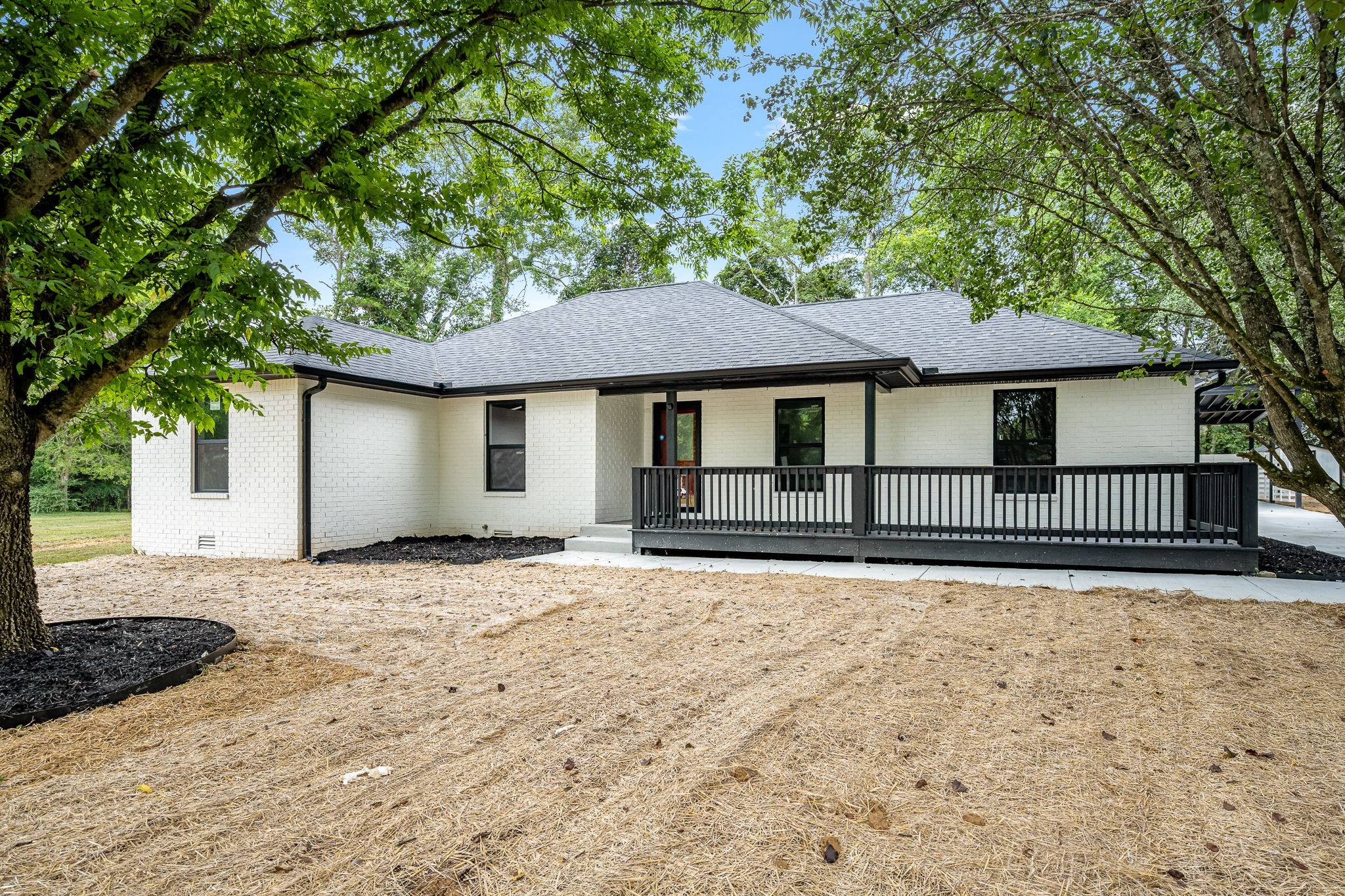 2712 Oak Point Street Murfreesboro, TN 37130 - Photo 3 of 45 a front view of a house with a garden and trees