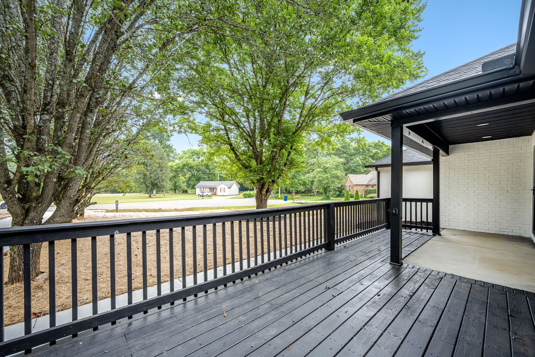 2712 Oak Point Street Murfreesboro, TN 37130 - Photo 8 of 45 a balcony with wooden floor and trees