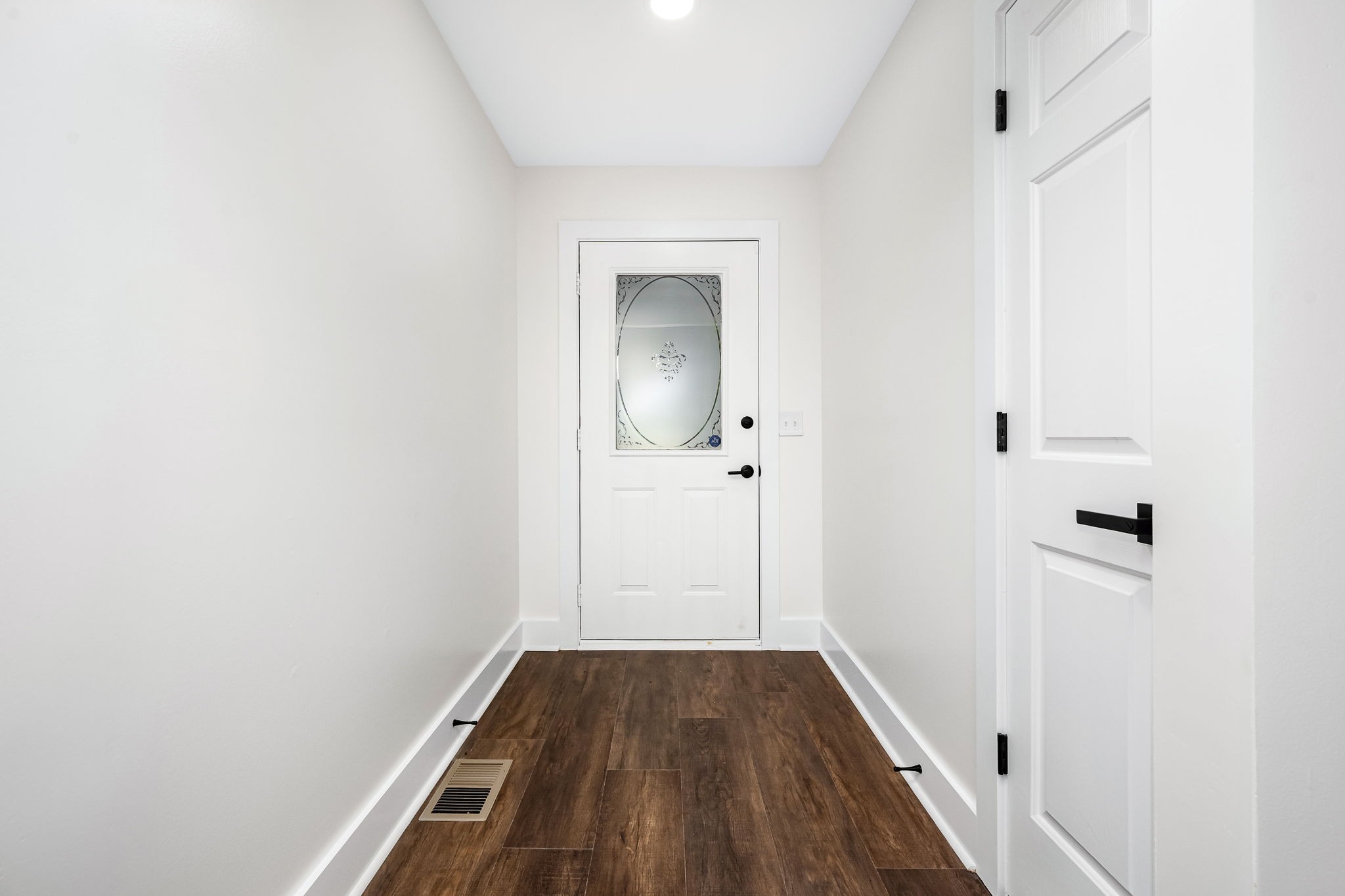 2712 Oak Point Street Murfreesboro, TN 37130 - Photo 10 of 45 a view of a hallway with wooden floor