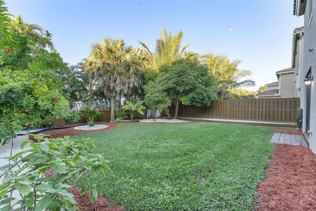 a view of a backyard with a garden