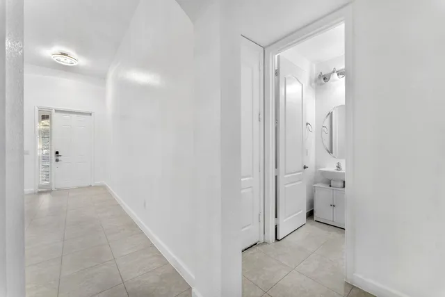 view of a bathroom with a toilet sink and a mirror