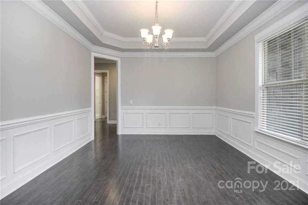 7007 Fallondale Road Waxhaw, NC 28173 - Photo 15 of 24 wooden floor in an empty room with a window