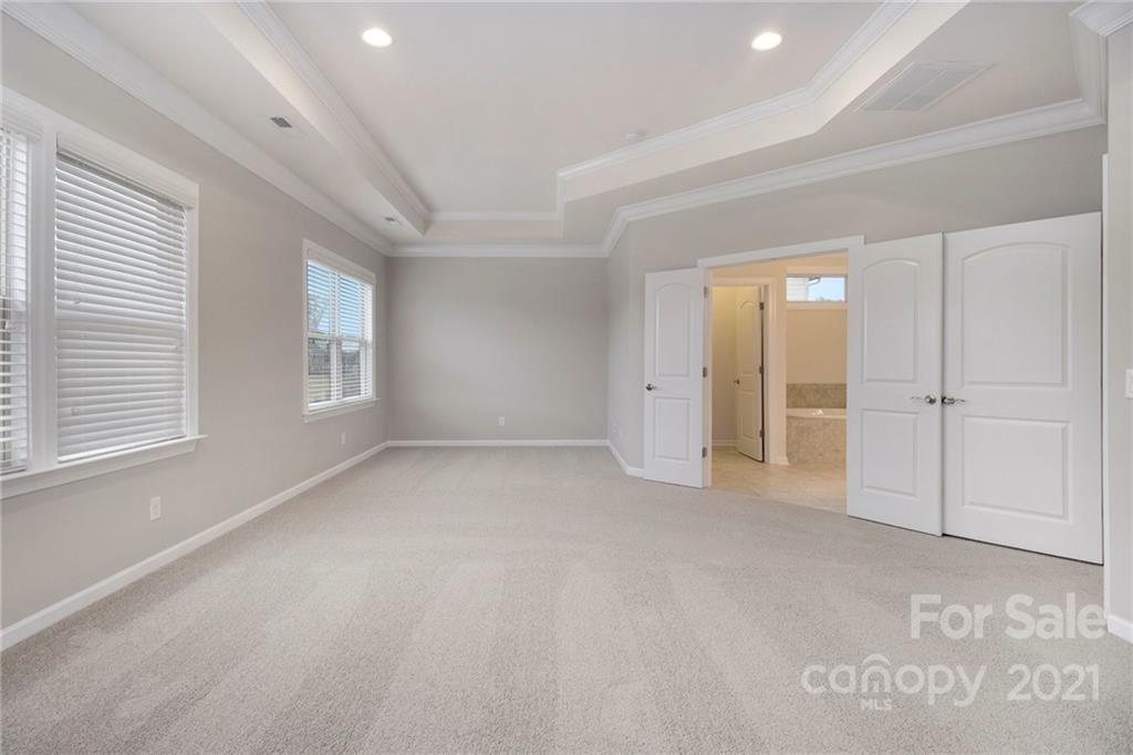 7007 Fallondale Road Waxhaw, NC 28173 - Photo 9 of 24 an empty room with windows and closet
