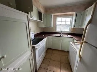 a utility room with a sink a washer and dryer