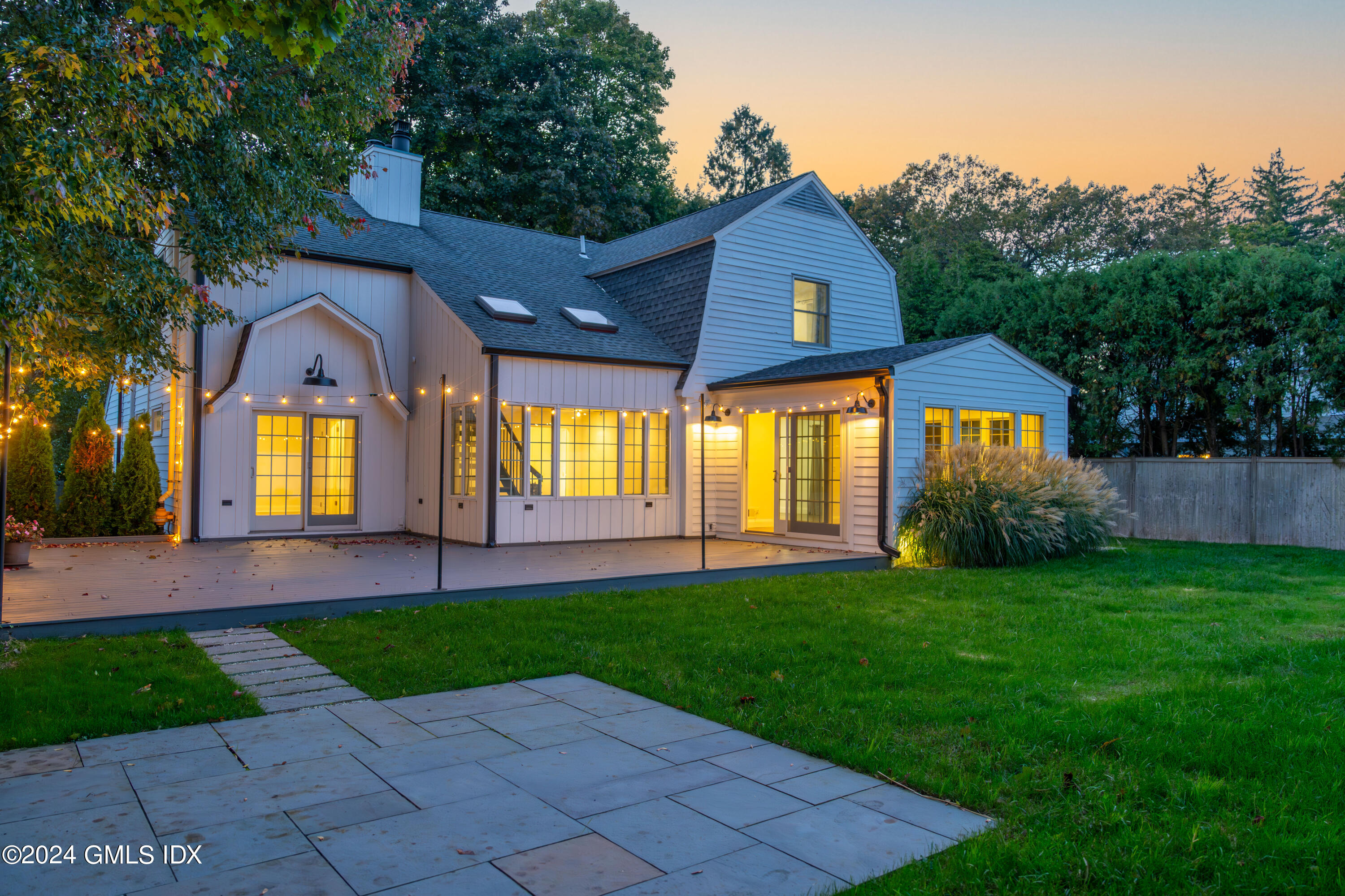 6 Hendrie Avenue Riverside, CT 06878 - Photo 35 of 44 a front view of a house with a yard and garage