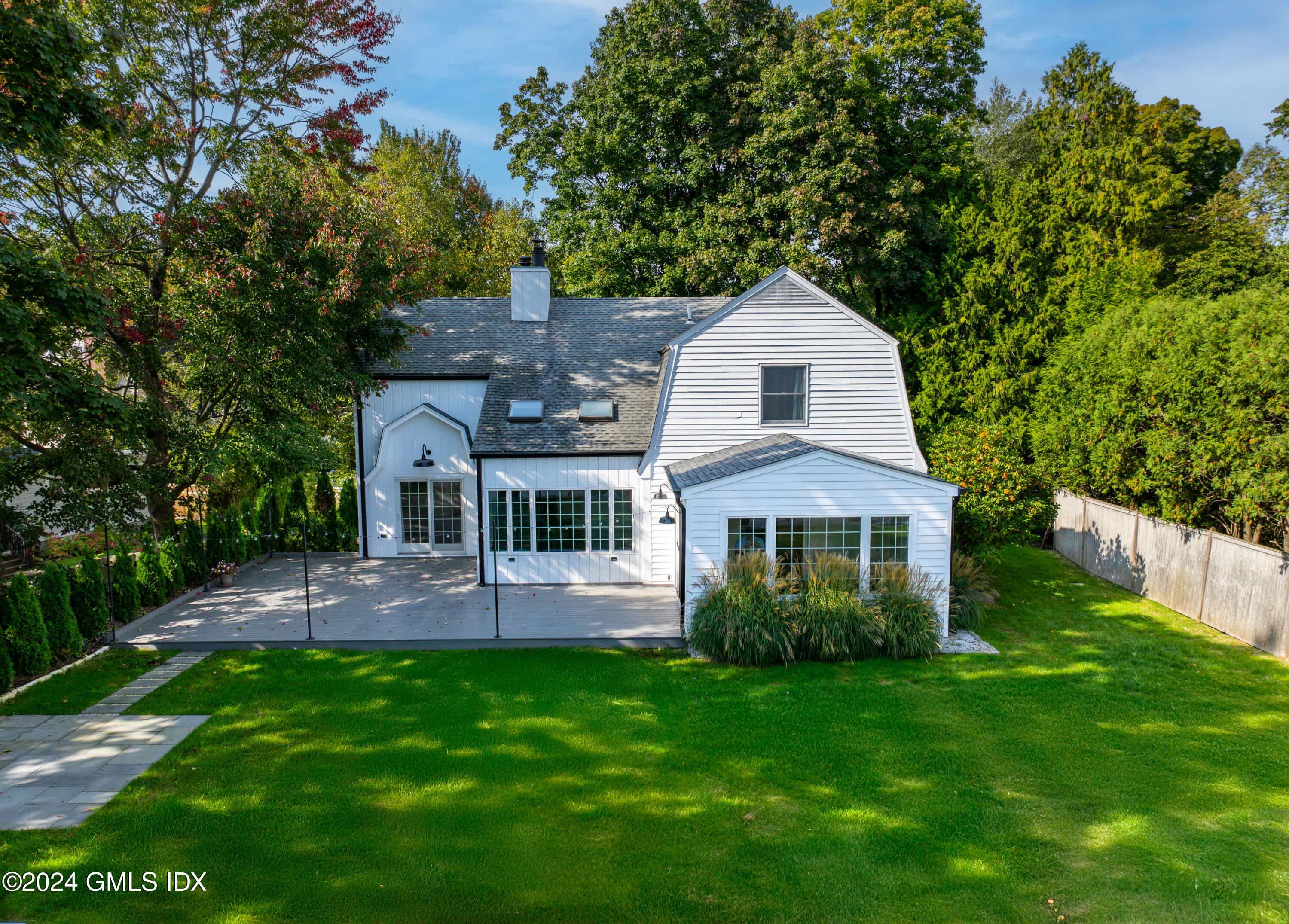 6 Hendrie Avenue Riverside, CT 06878 - Photo 5 of 44 a front view of a house with a yard