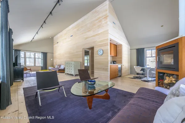 a kitchen with sink cabinets and living room