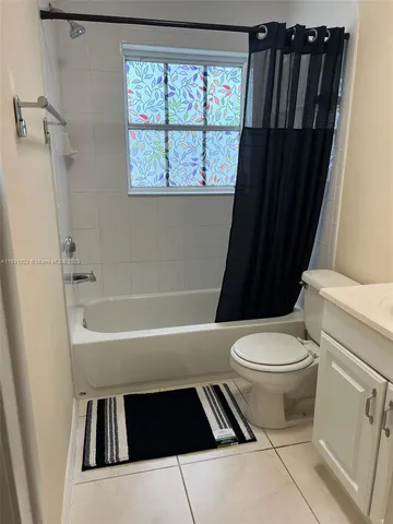 a bathroom with a toilet a sink and a bathtub