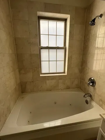 a bathroom with a bathtub