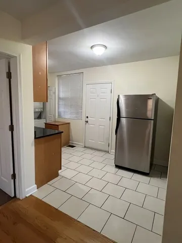 a kitchen with stainless steel appliances a refrigerator and a sink