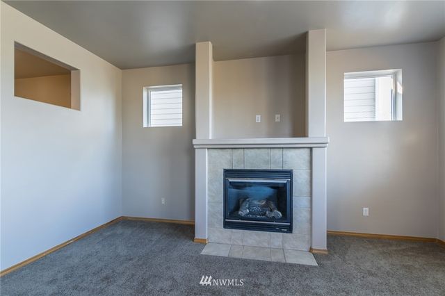 a living room with a fireplace