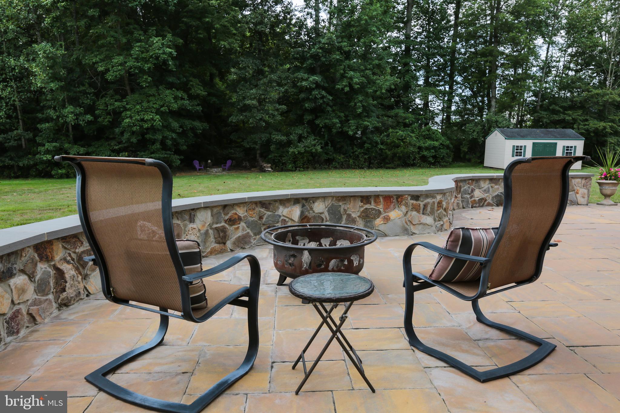 4557 Spring Run Road Warrenton, VA 20187 - Photo 61 of 68 Fire Pit on the Paver Patio with Tree Views