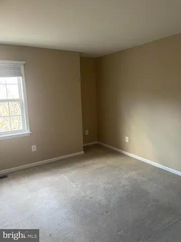 a view of room with air conditioner and window