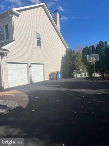 a view of a house with a street