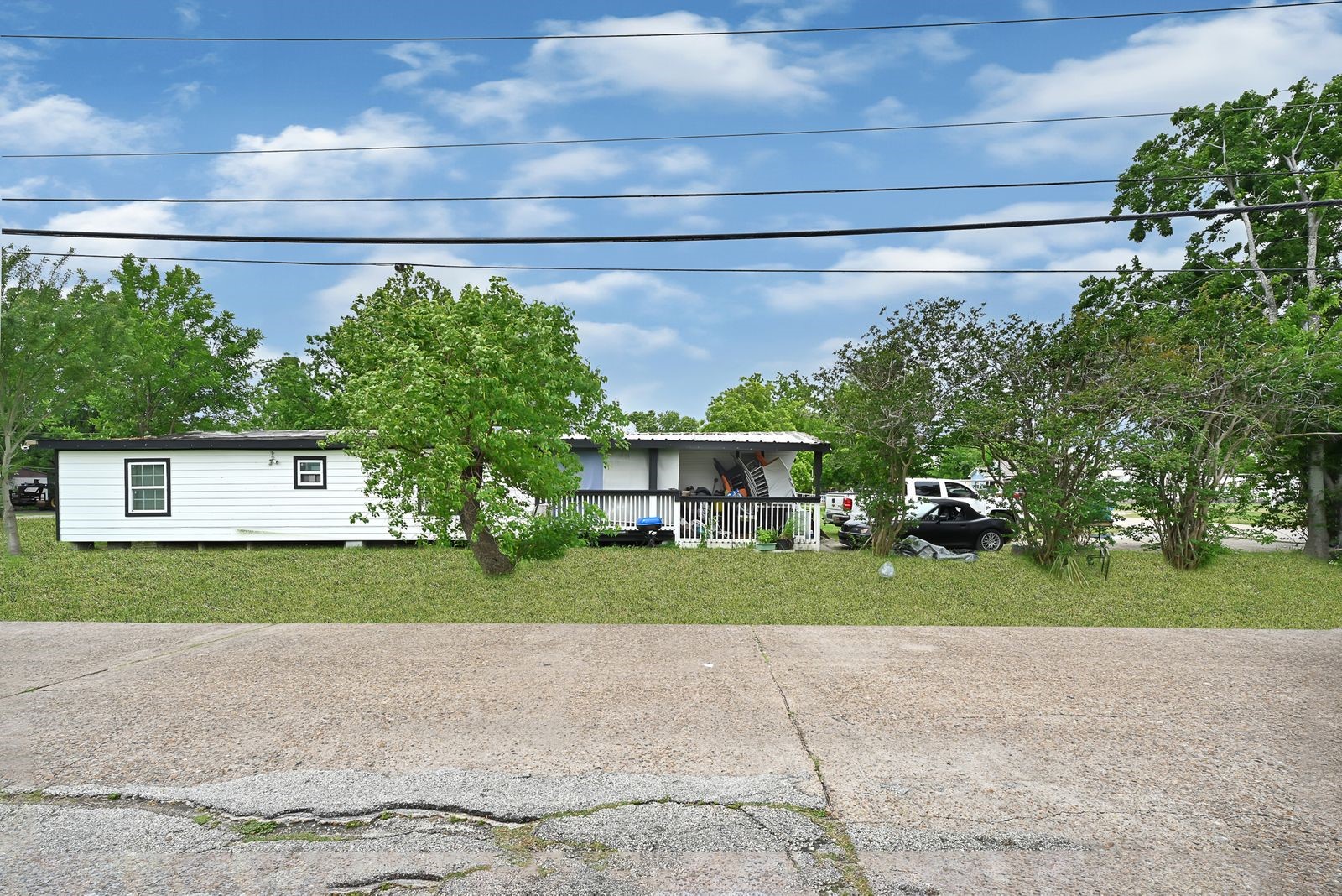 602 Indiana Street South Houston, TX 77587 - Photo 2 of 7 a front view of a house with a yard and garage