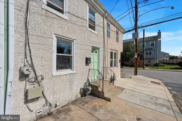 a building exterior with furniture