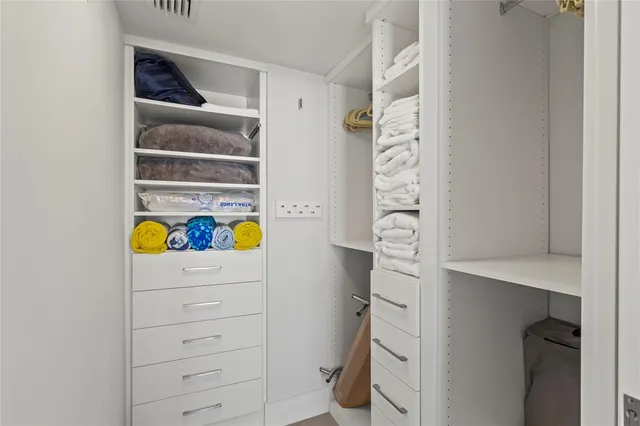 a spacious bathroom with a double vanity sink mirror and toilet