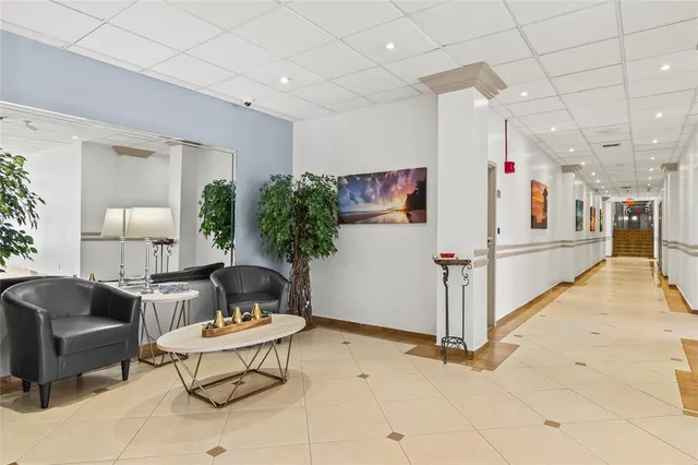 a living room with furniture a table and chairs