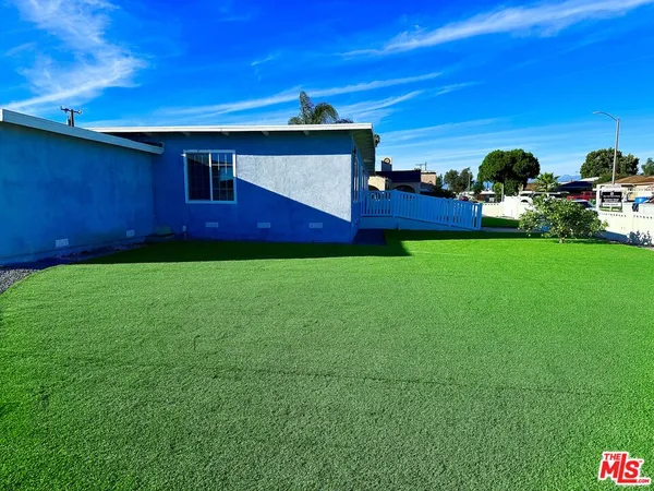 a view of room with wooden floor