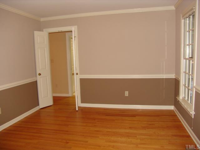 7237 Rabbit Run Wake Forest, NC 27587 - Photo 3 of 12 This could be a parlor or a formal dining room. It has a beautiful view out of the front windows. It adjoins the foyer and has hardood floor, crown molding, and chair rail molding.