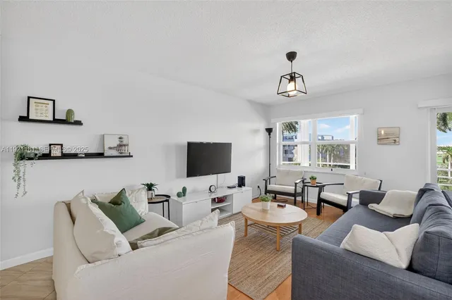 a living room with furniture and view
