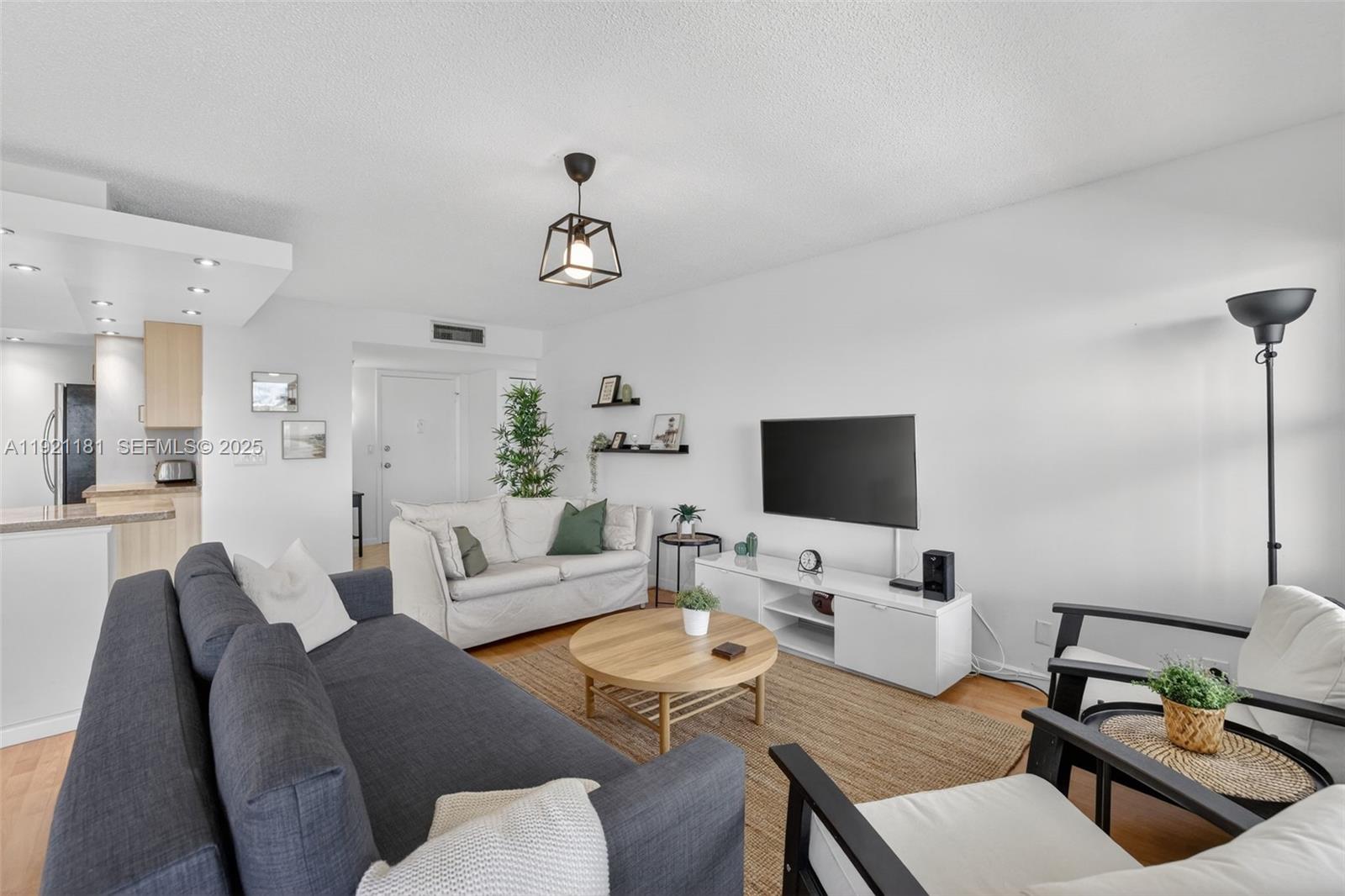 200 Diplomat Parkway, Unit 531 Hallandale Beach, FL 33009 - Photo 17 of 45 a living room with furniture and view