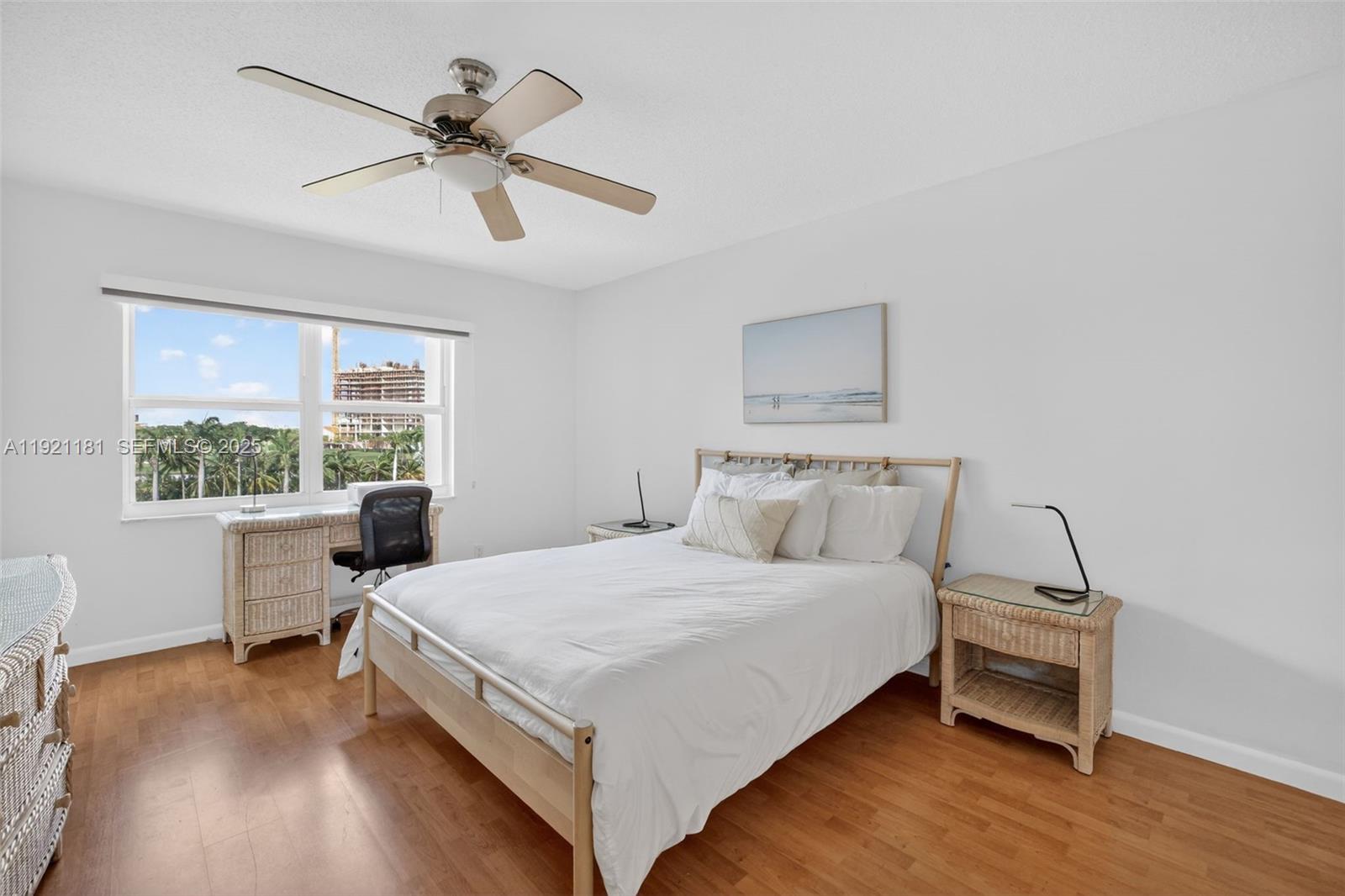 200 Diplomat Parkway, Unit 531 Hallandale Beach, FL 33009 - Photo 18 of 45 a large white bed sitting in a room next to a window