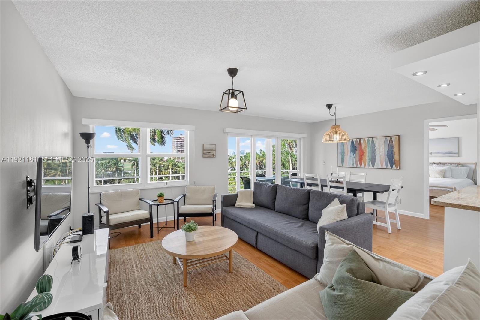 200 Diplomat Parkway, Unit 531 Hallandale Beach, FL 33009 - Photo 2 of 45 a living room with furniture and a large window