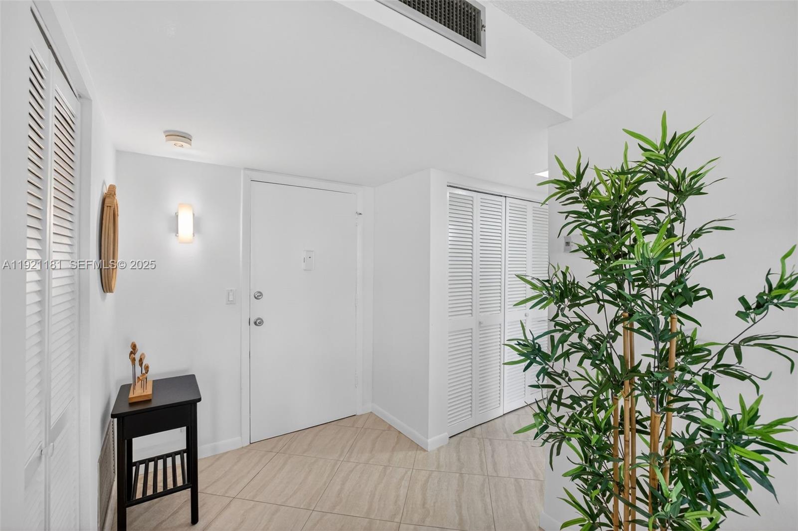 200 Diplomat Parkway, Unit 531 Hallandale Beach, FL 33009 - Photo 22 of 45 wooden floor in an empty room