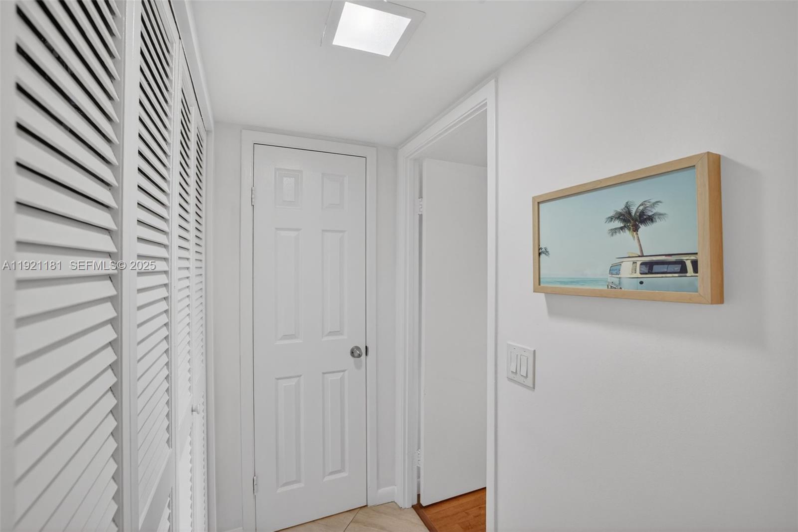 200 Diplomat Parkway, Unit 531 Hallandale Beach, FL 33009 - Photo 23 of 45 a view of a hallway with wooden floor