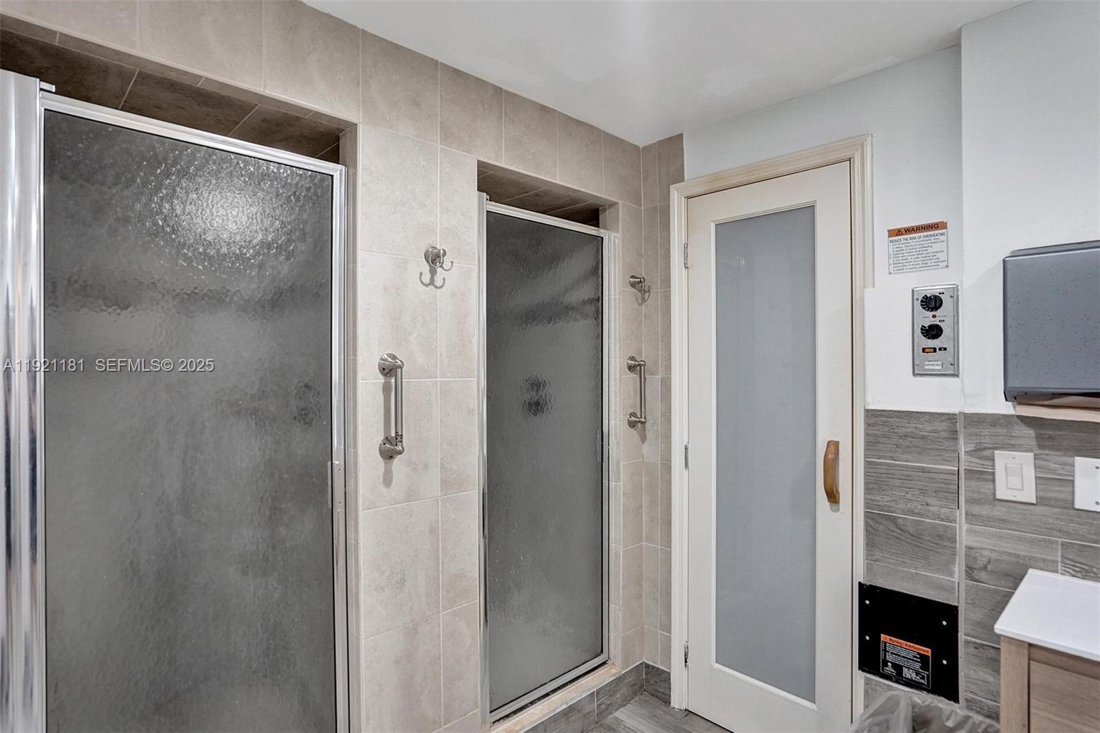 200 Diplomat Parkway, Unit 531 Hallandale Beach, FL 33009 - Photo 34 of 45 a bathroom with a shower and a sink