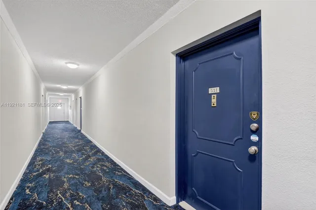 a kitchen with cabinets a sink and appliances