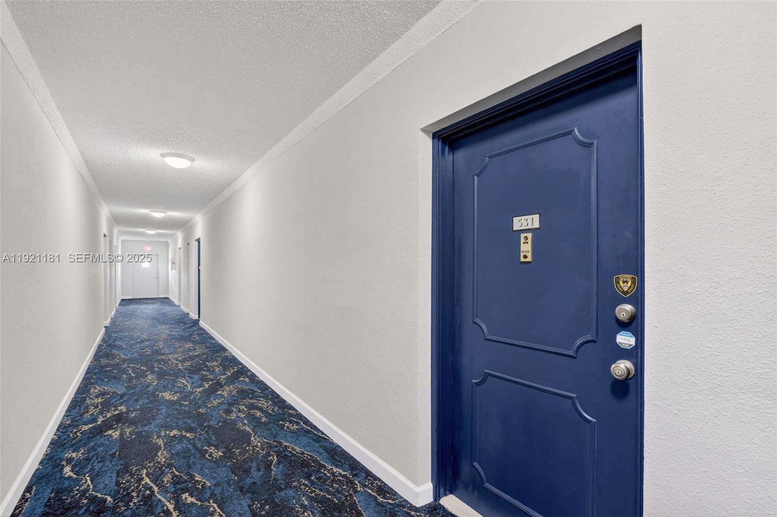 200 Diplomat Parkway, Unit 531 Hallandale Beach, FL 33009 - Photo 35 of 45 a view of a hallway with wooden floor