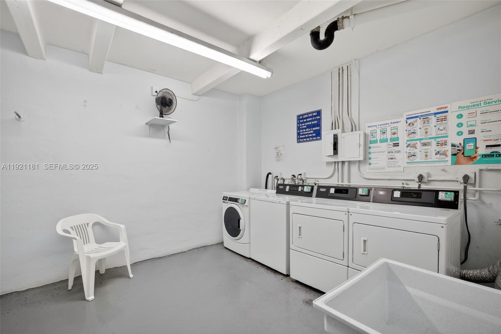 200 Diplomat Parkway, Unit 531 Hallandale Beach, FL 33009 - Photo 36 of 45 a kitchen with cabinets a sink and appliances