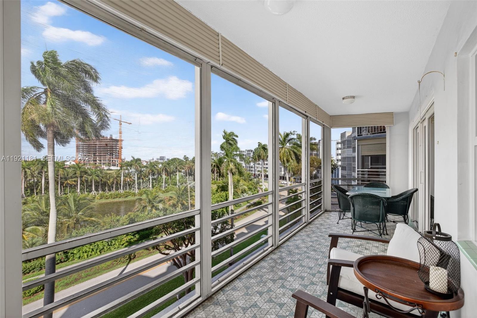 200 Diplomat Parkway, Unit 531 Hallandale Beach, FL 33009 - Photo 6 of 45 a room with pool table and chairs
