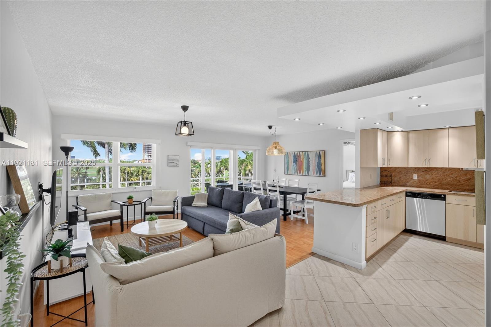 200 Diplomat Parkway, Unit 531 Hallandale Beach, FL 33009 - Photo 9 of 45 a living room with stainless steel appliances granite countertop furniture and a view of living room