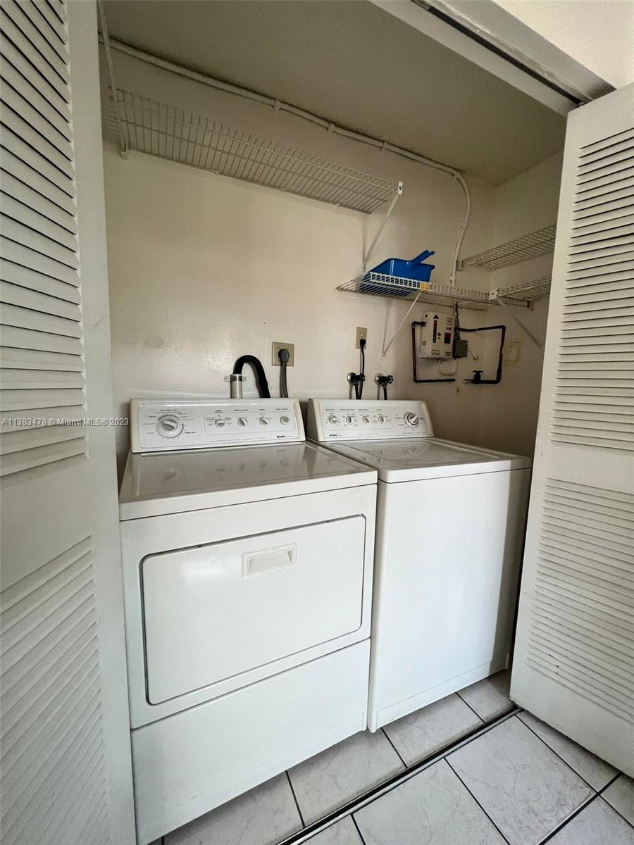 Kendale Lakes Miami, FL 33183 - Photo 3 of 19 a utility room with dryer and washer